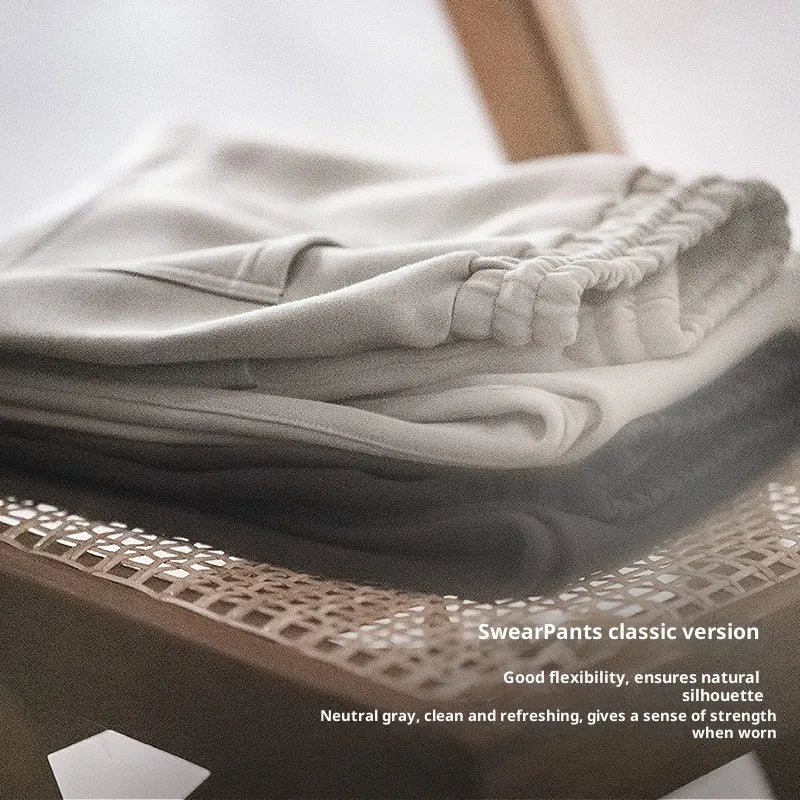 Men's cotton air layer straight-leg sweatpants in dark gray on a model