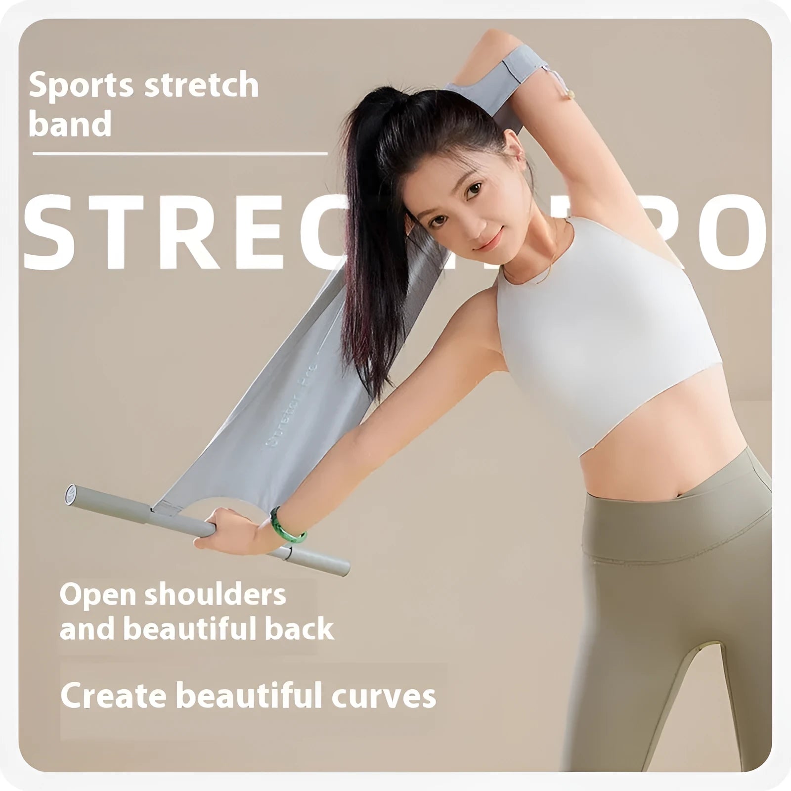 Grey and pink yoga stretching tool for shoulder and hip flexibility on a plain background.