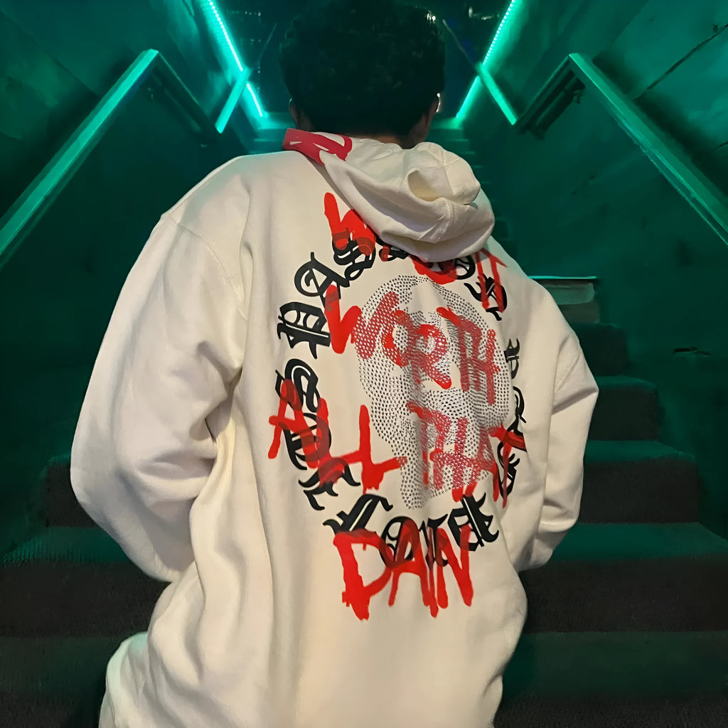 Black loose hooded sweatshirt with printed skull and rhinestone lettering on front