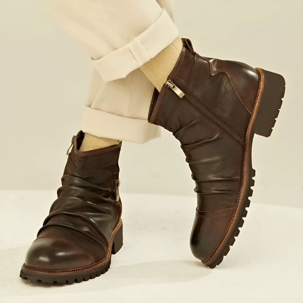 Black high-top cowboy-style Martin boots with a side zipper and a distinctive horseshoe-shaped heel