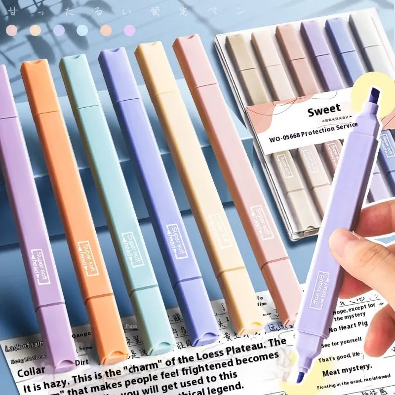 Fluorescent double-headed marking pens in mixed colour assortment with both broad and fine tips visible.