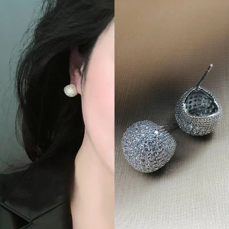 Geometric drop-shaped ear clip earrings with full diamond little golden beans detailing in gold and white finishes