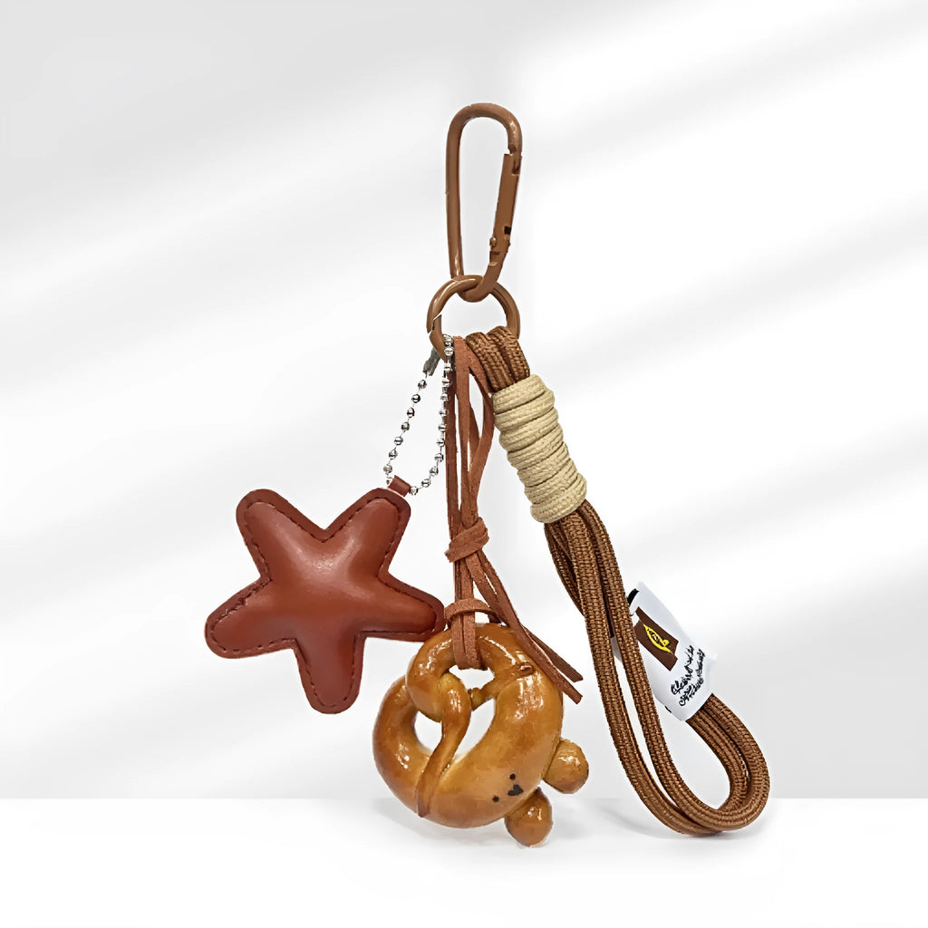 Handmade soda bread style resin handbag pendant with brown strap and baked varnish finish