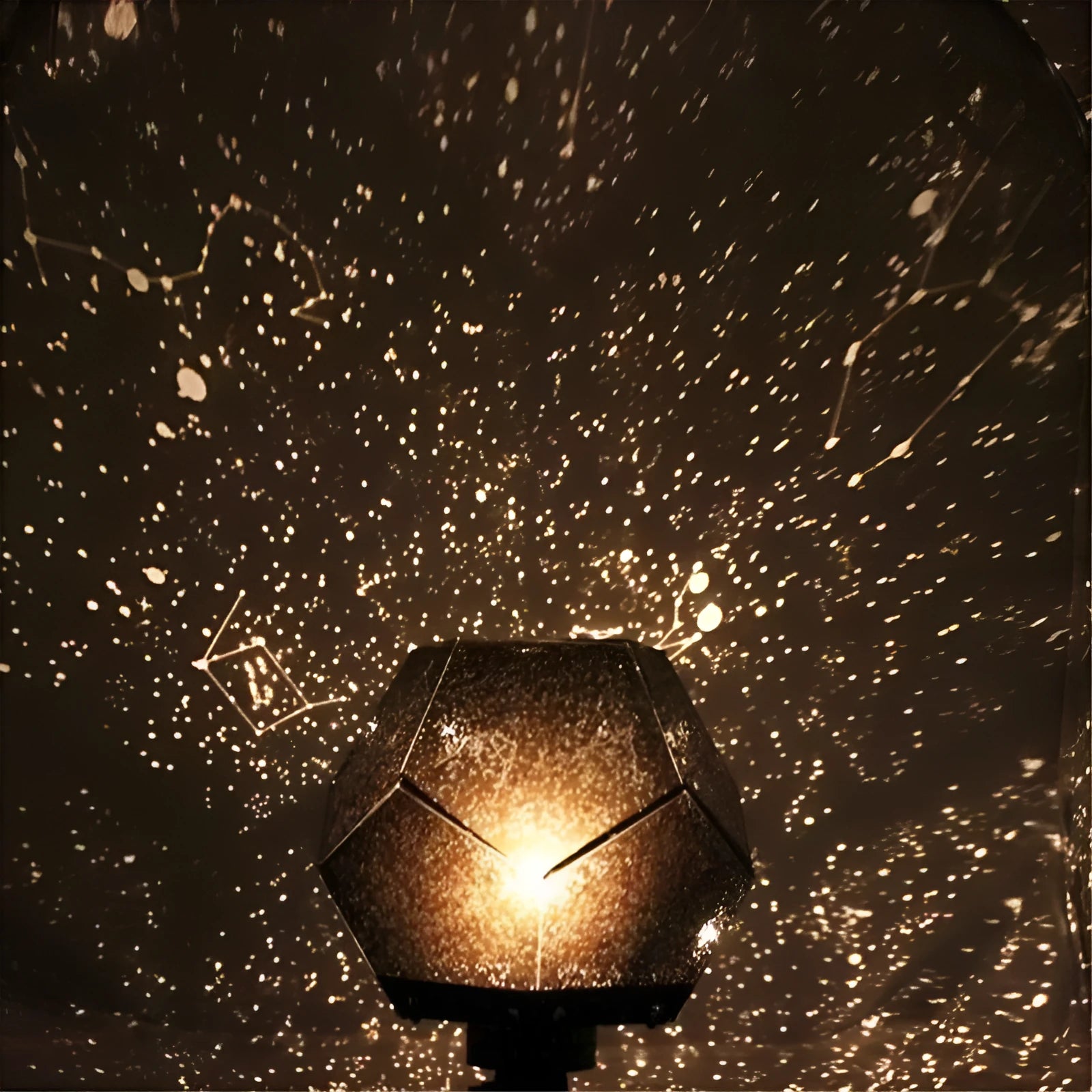 LED star projector night light showing constellation projection on a bedroom ceiling with remote control.