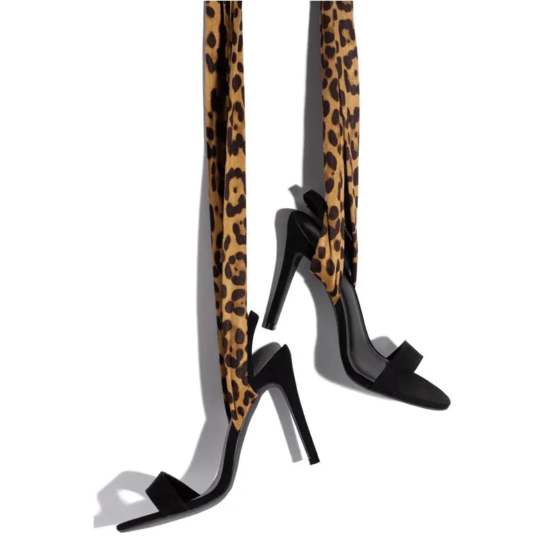 Light brown leopard print high heel shoes with cross straps and super high heel