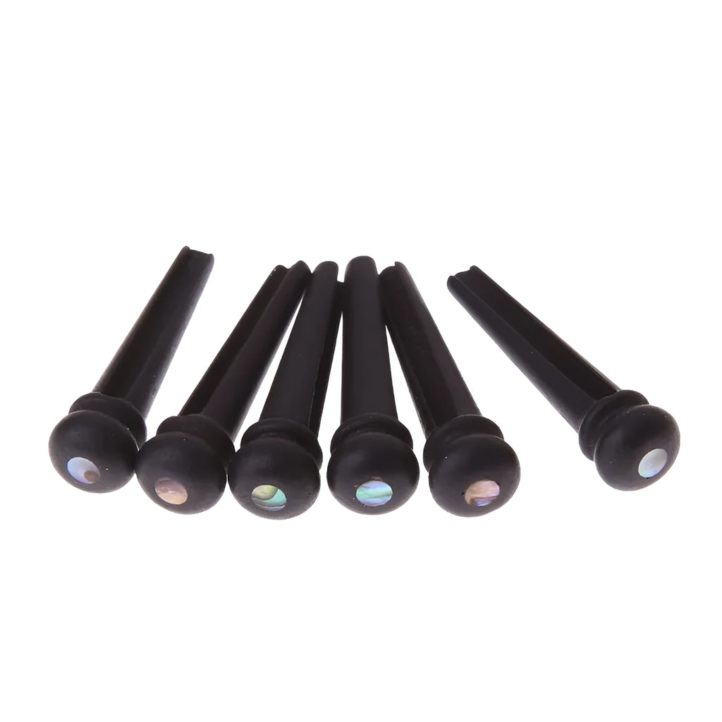 Six black matt ebony guitar bridge pins with solid string cone design
