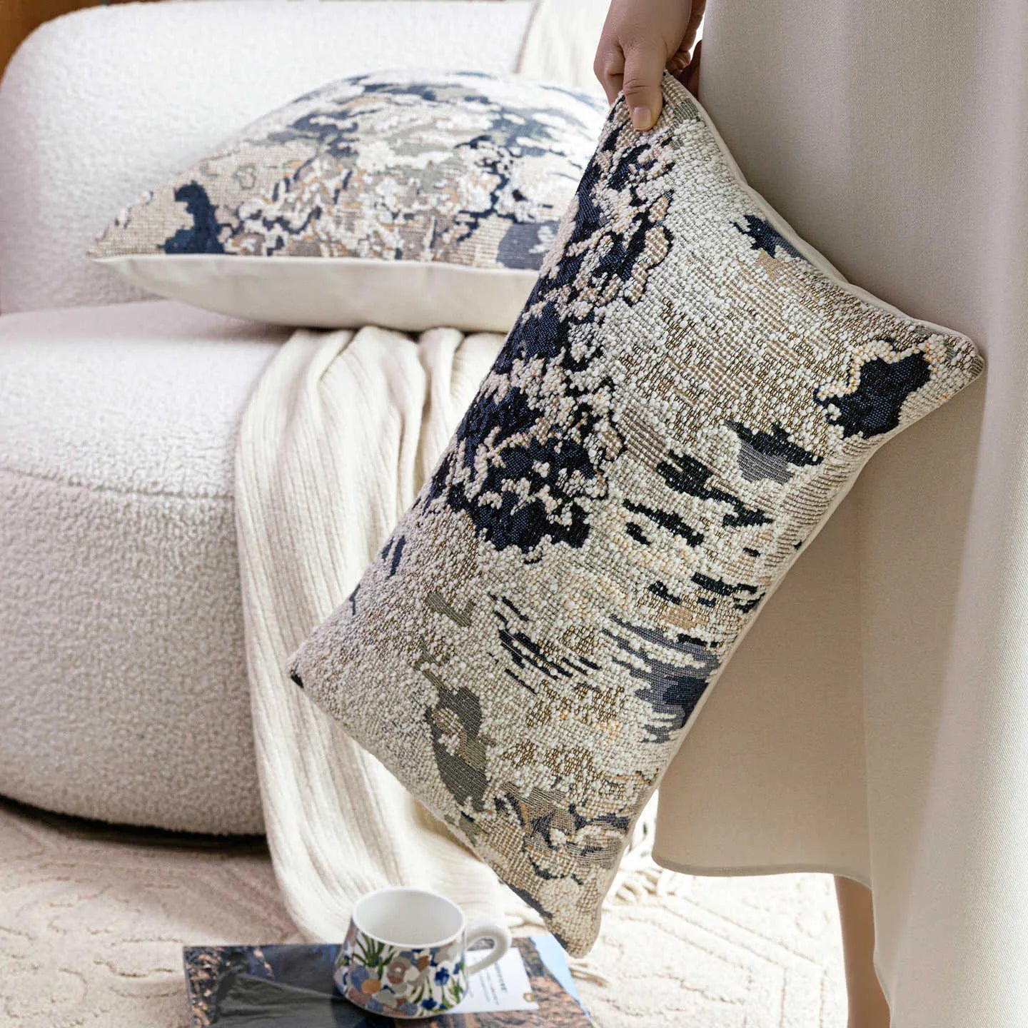 Antique blue abstract floral decorative cushion on wool blend fabric in square and waist sizes.