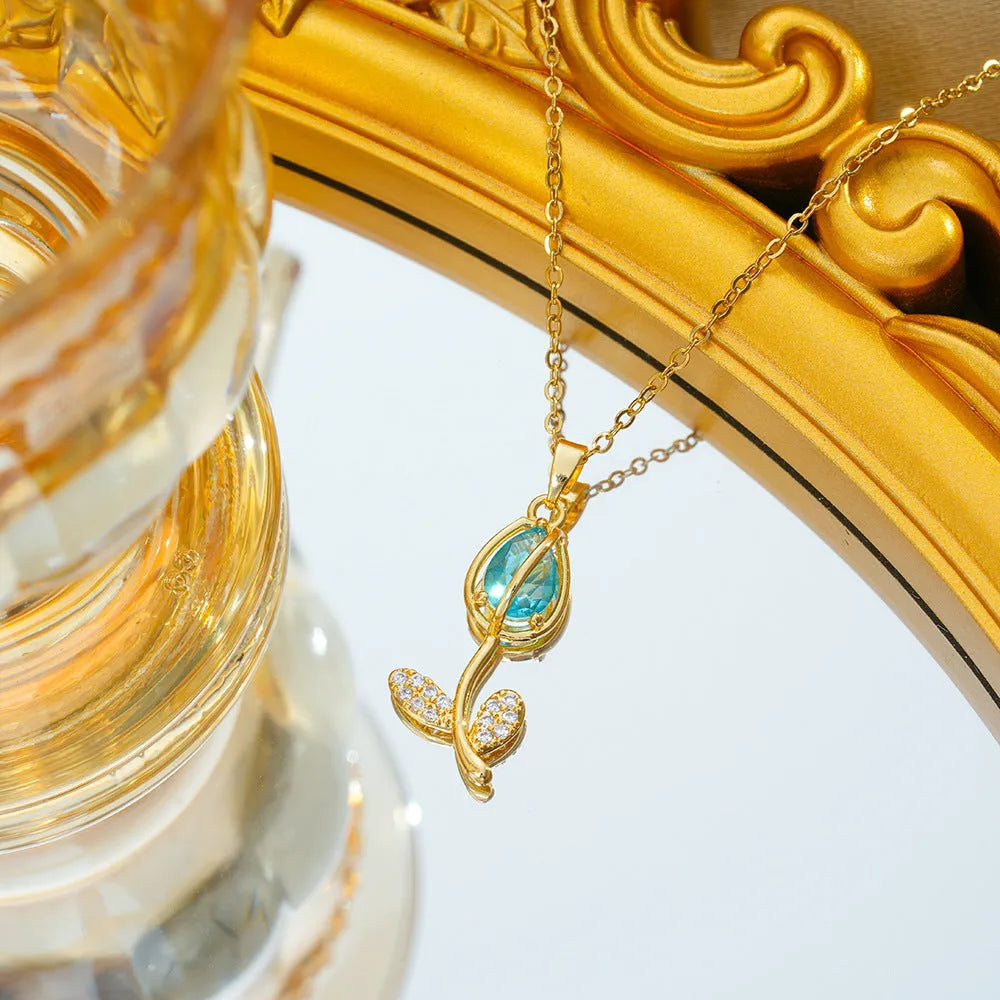 Gold-coloured tulip flower pendant necklace on a titanium steel chain for women.