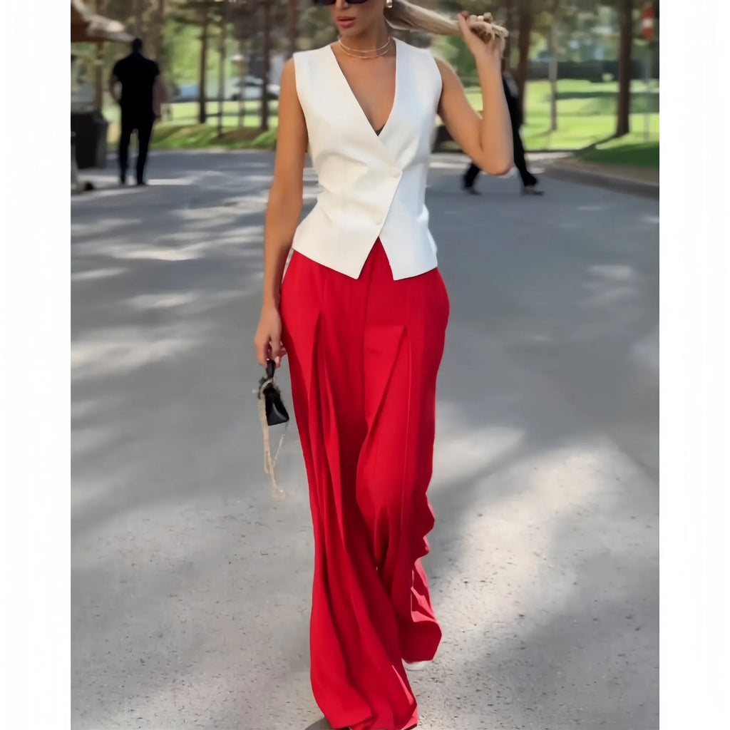 Beige women's two-piece set with deep V-neck sleeveless top and high-waist wide leg trousers