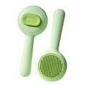 Green and yellow cat grooming brush with stainless steel comb and non-slip silicone handle.