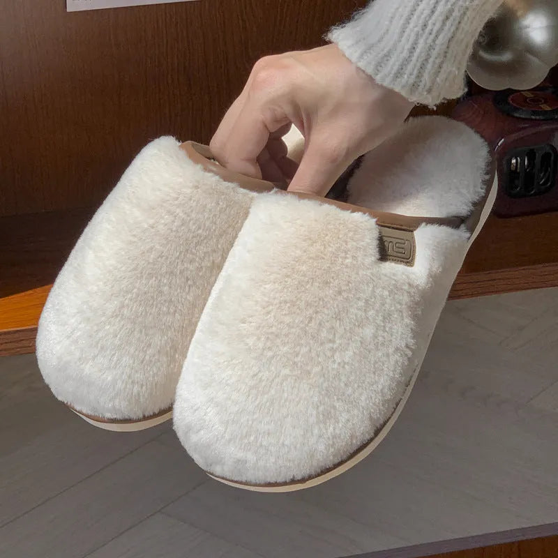 Winter plush slippers in solid colours with non-slip PVC soles and car stitching detail
