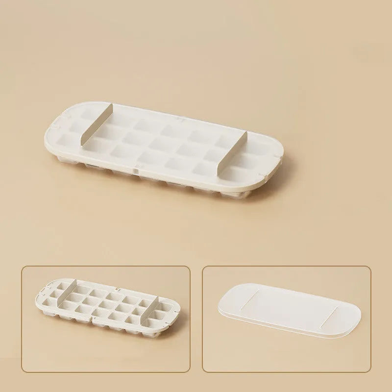 Yellow high-capacity ice cube tray with grid design and a storage slot for an ice shovel.