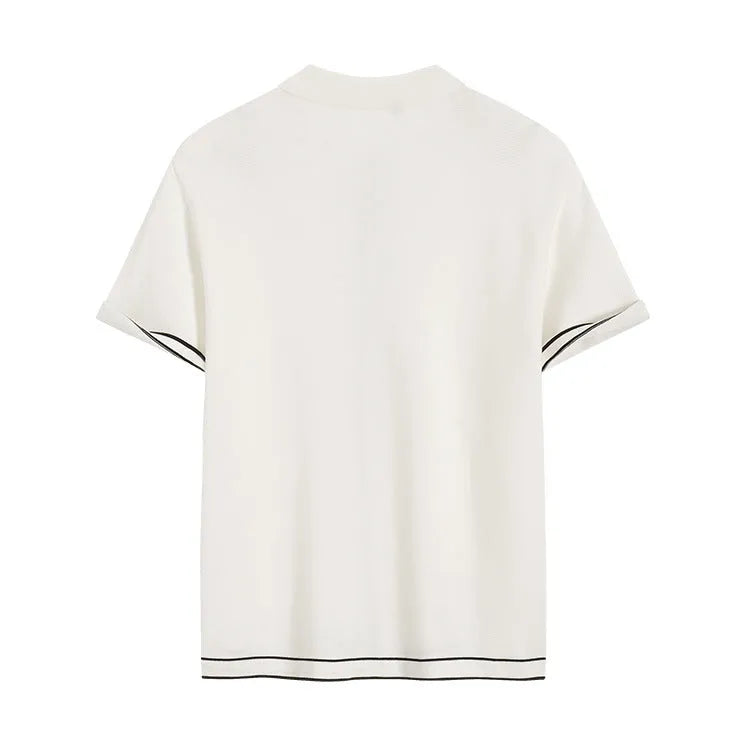 Women's white short sleeve cardigan shirt with contrast colour lapels on a hanger.