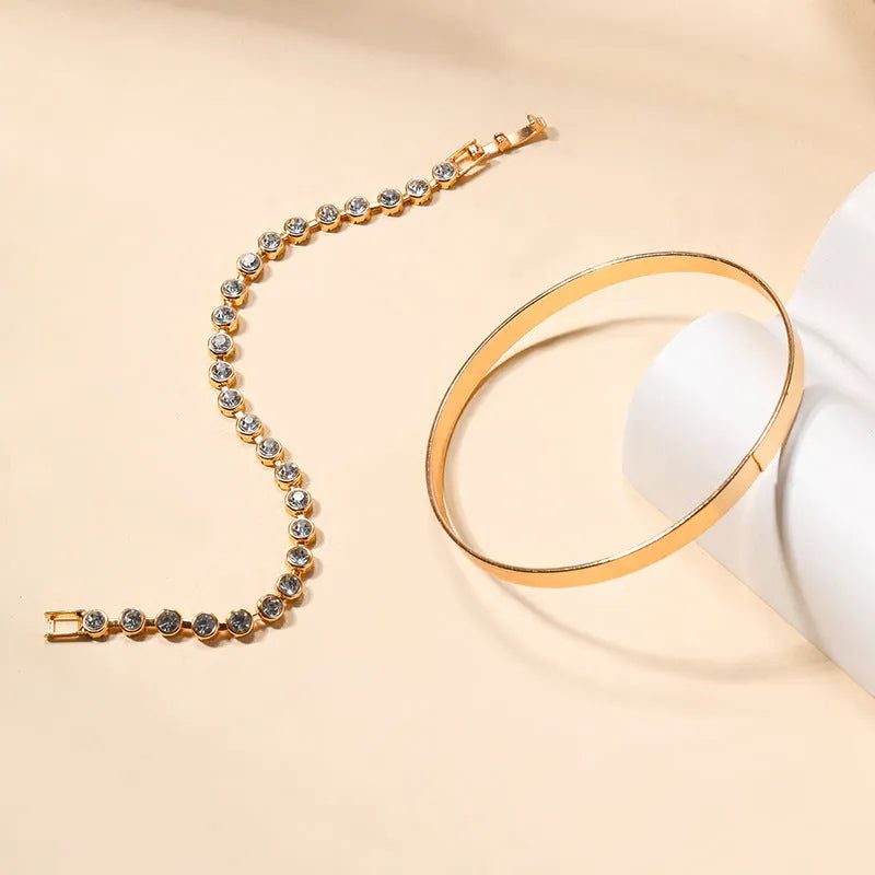 Gold and silver zinc alloy vintage bracelet set with drop-shaped geometric links on a white background
