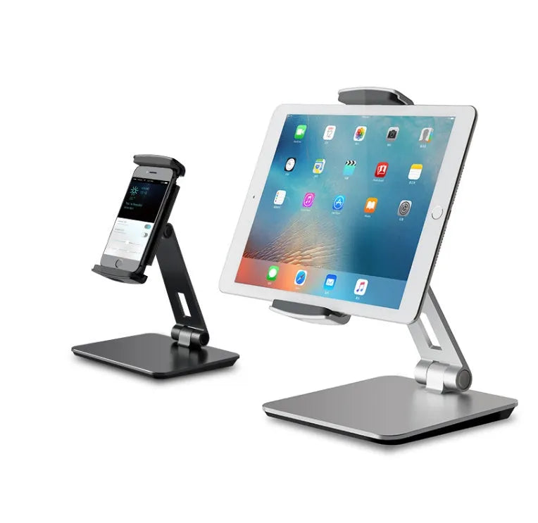 Silver aluminium and ABS folding stand holding a tablet, showing 360-degree rotation and anti-slip silicone pads.