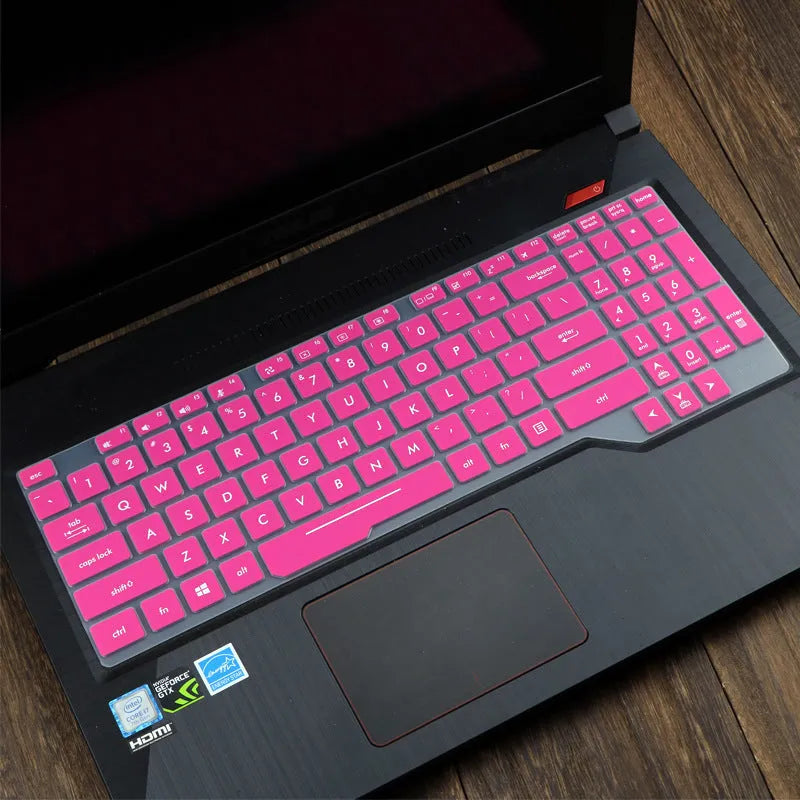 Clear protective keyboard film cover for ASUS Flight 14-inch laptop on a keyboard.