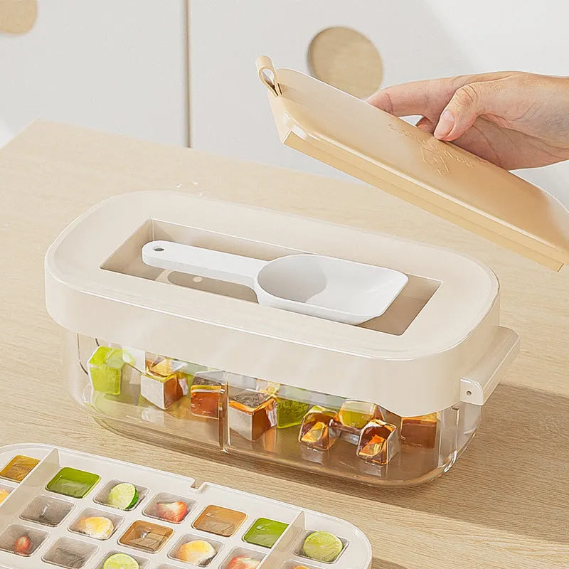 Yellow high-capacity ice cube tray with grid design and a storage slot for an ice shovel.