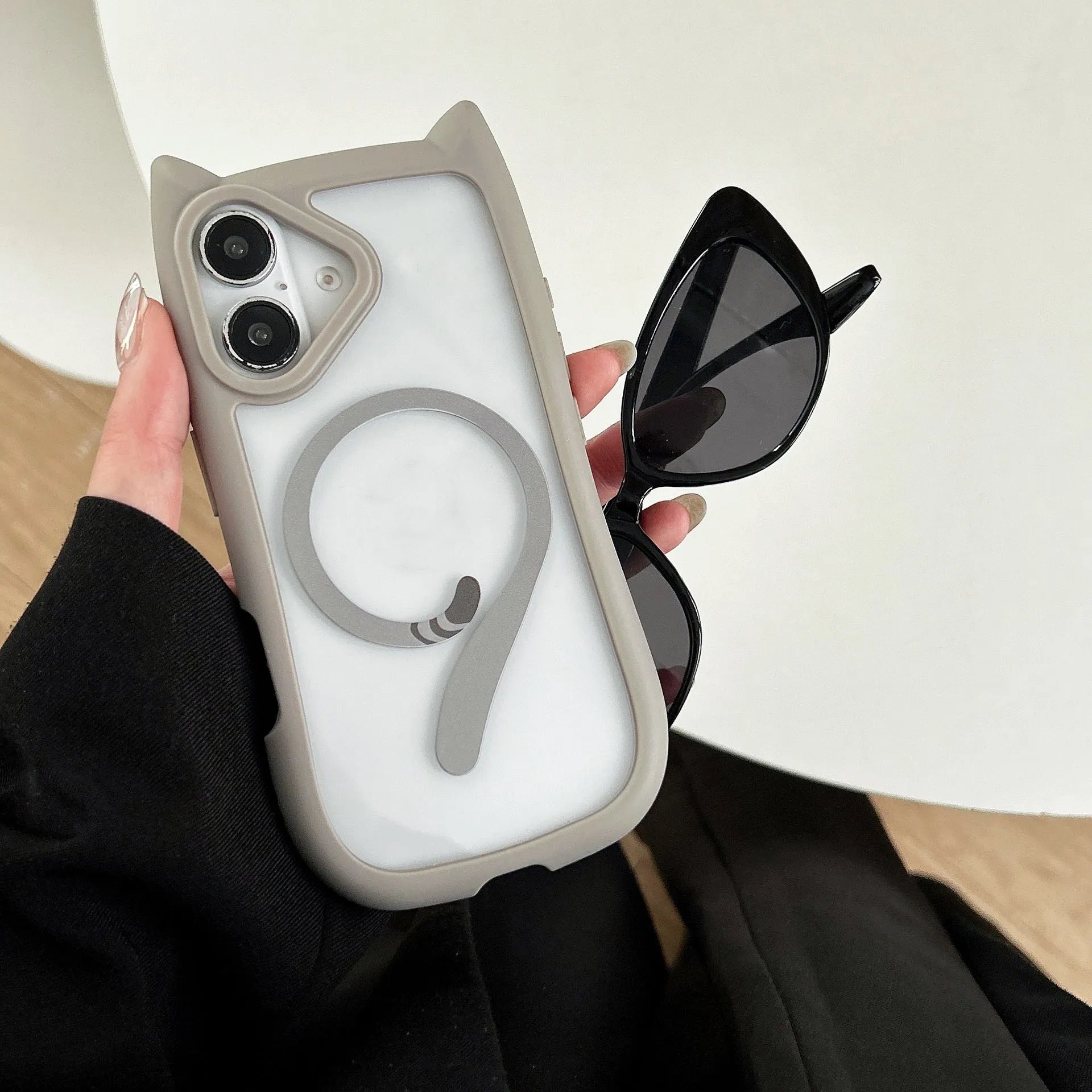 Transparent acrylic TPU iPhone 17 phone case showing magnetic suction feature and colour options