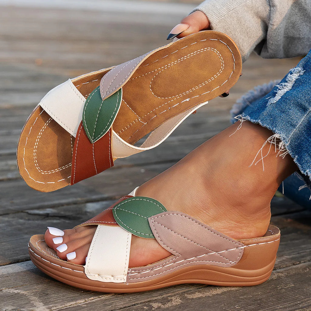 Women's red-brown cork wedge sandals with leaf design and gladiator lace-up ankle strap