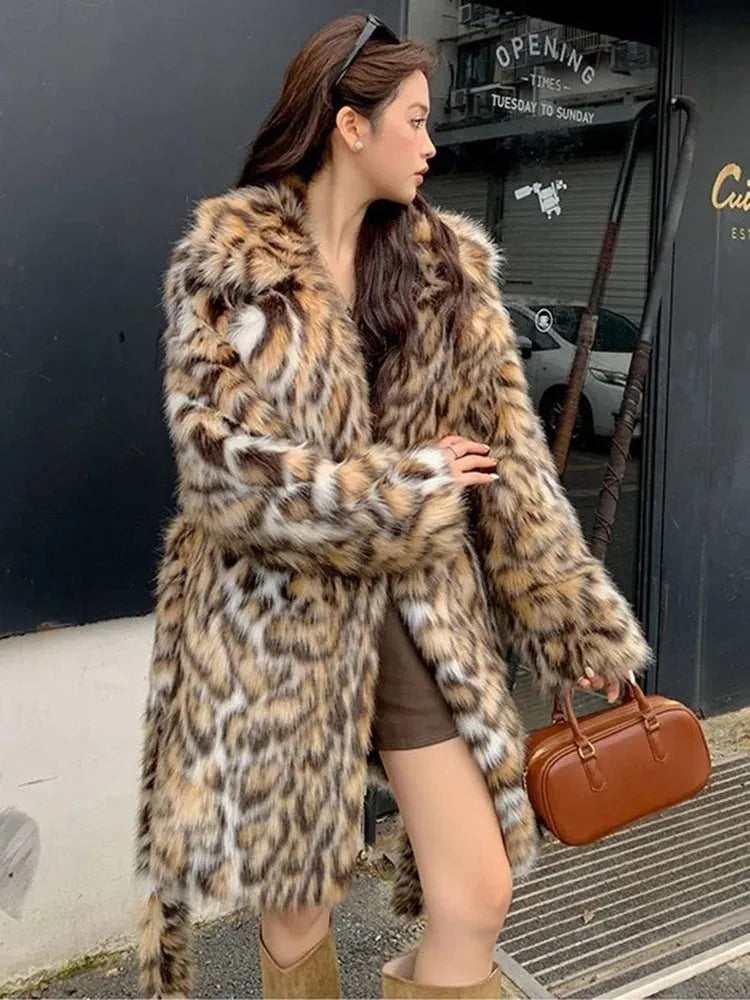 A woman wearing a long plush faux fur coat with a detachable fur collar and pockets, shown in a street fashion setting.