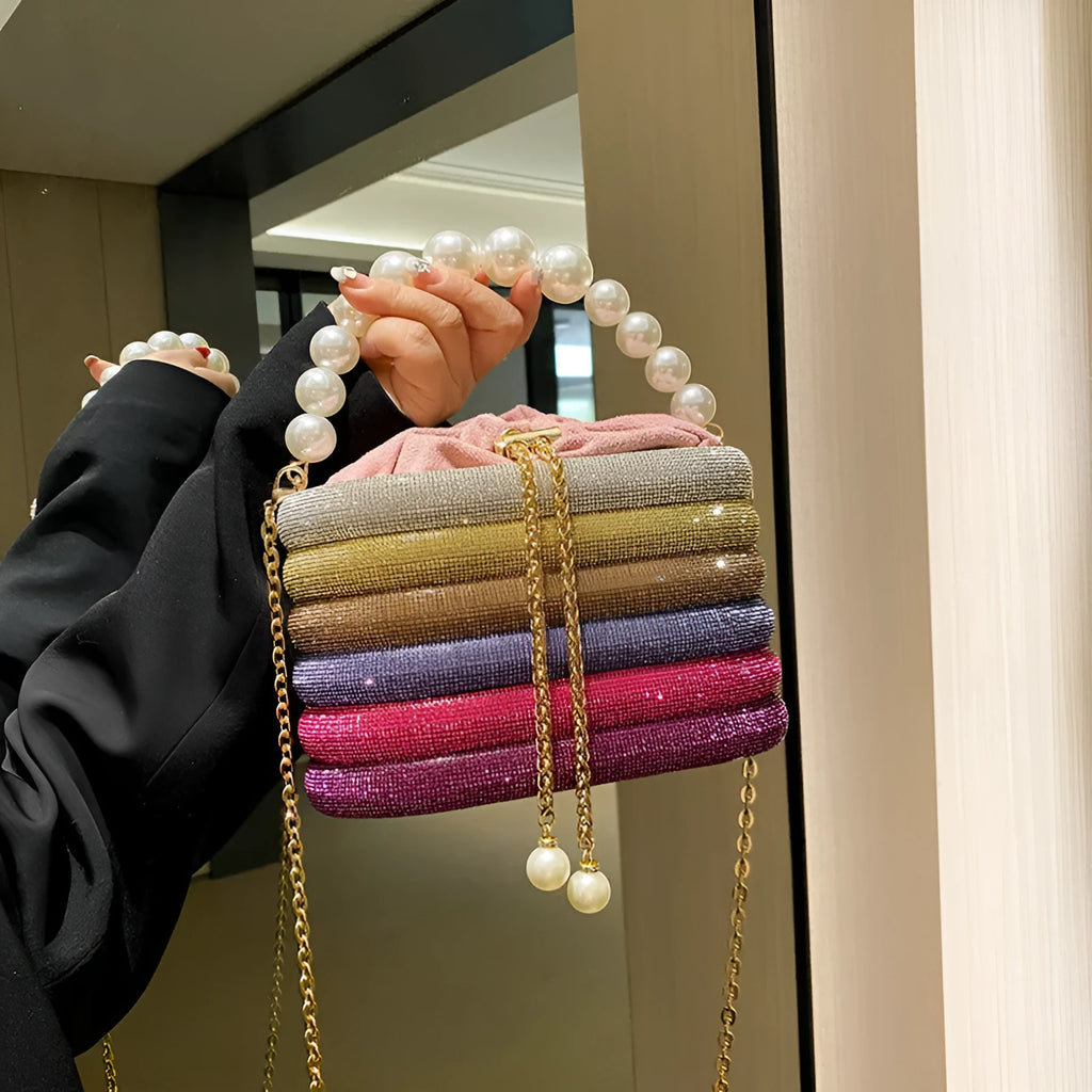 Women's retro style crossbody bag with pearl beads and rounded shape in soft PU material
