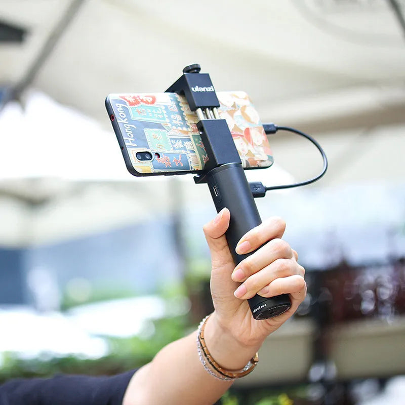 Black aluminium alloy portable power bank with built-in handle showing 6800mAh capacity