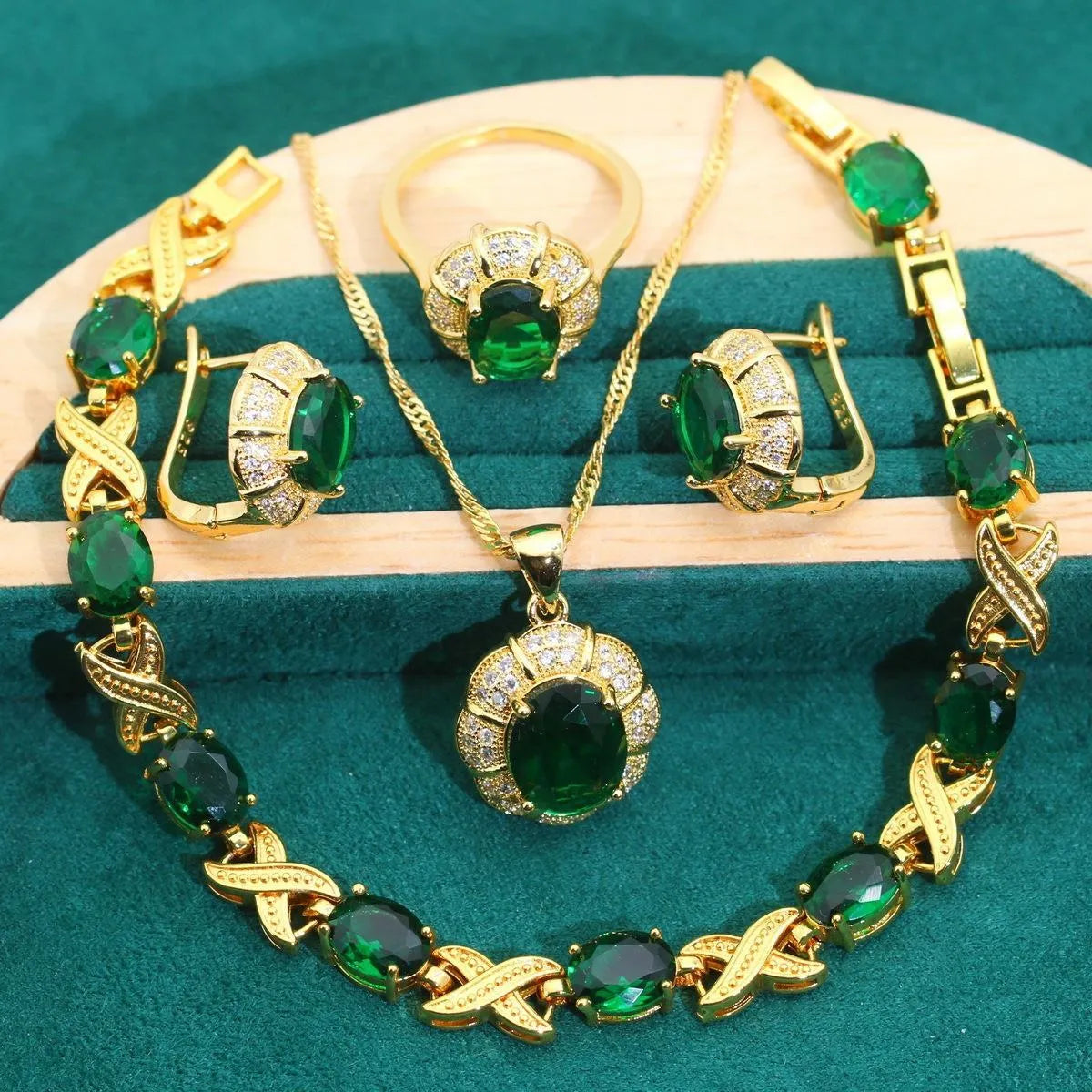 18k gold plated jewellery set showing necklace, earrings, ring and bracelet with coloured cubic zirconia stones.