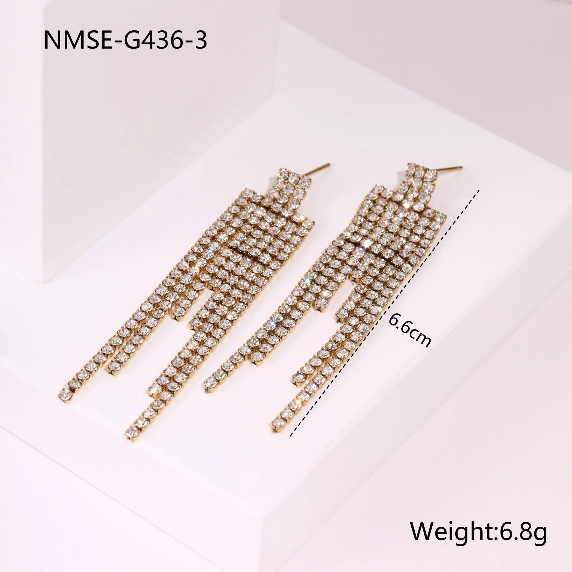 Stainless steel tassel earrings with 18K gold electroplated finish and diamond tips in heart and star shapes