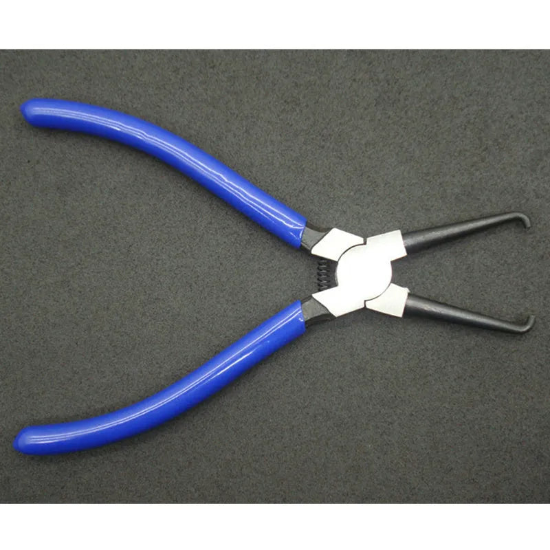 Iron and rubber caliper tubing pliers tool for automotive fuel line fittings in L and S sizes.
