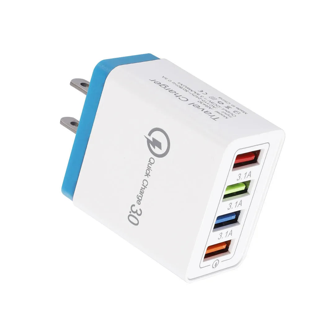 Dark blue 4-port USB wall charger with EU plug next to mobile phone