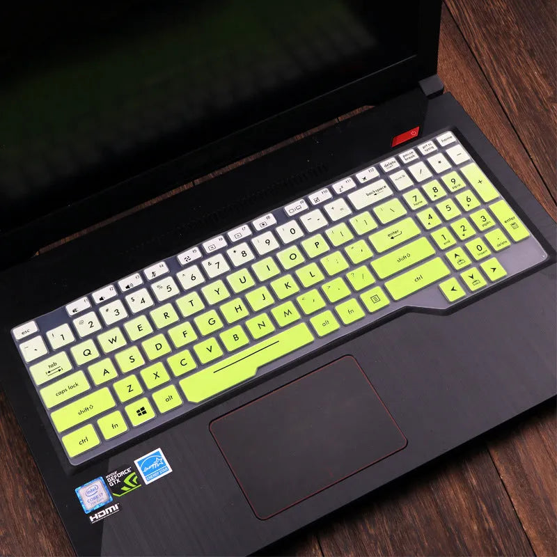 Clear protective keyboard film cover for ASUS Flight 14-inch laptop on a keyboard.