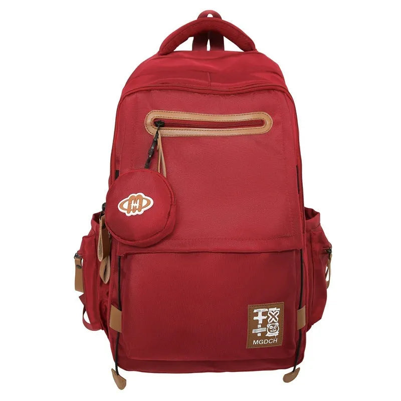 Nylon school backpack with curved shoulder straps in multiple colour options including khaki and red