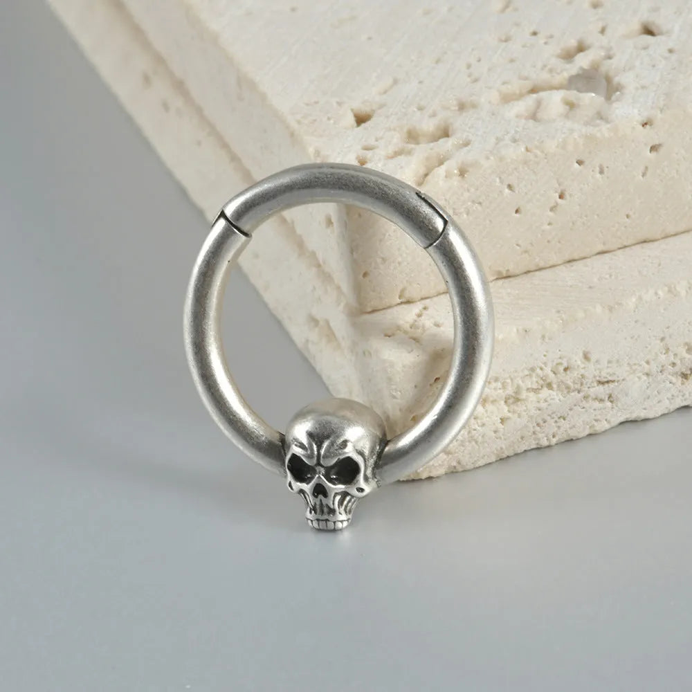 Copper punk earrings with vintage ghost head design in antique gold and silver finishes