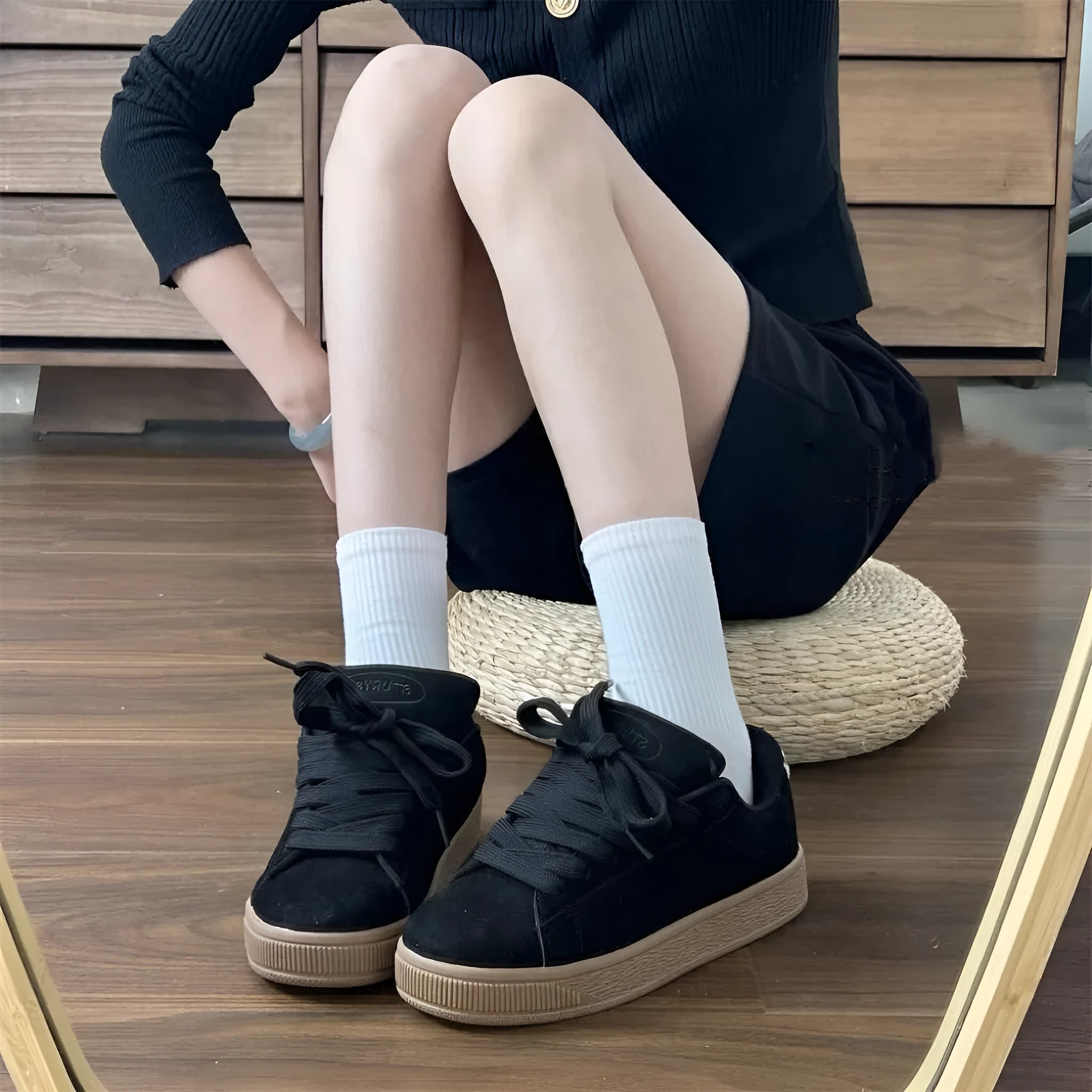 Retro black low-top sneakers with round toe, waterproof platform, and injection-moulded rubber sole