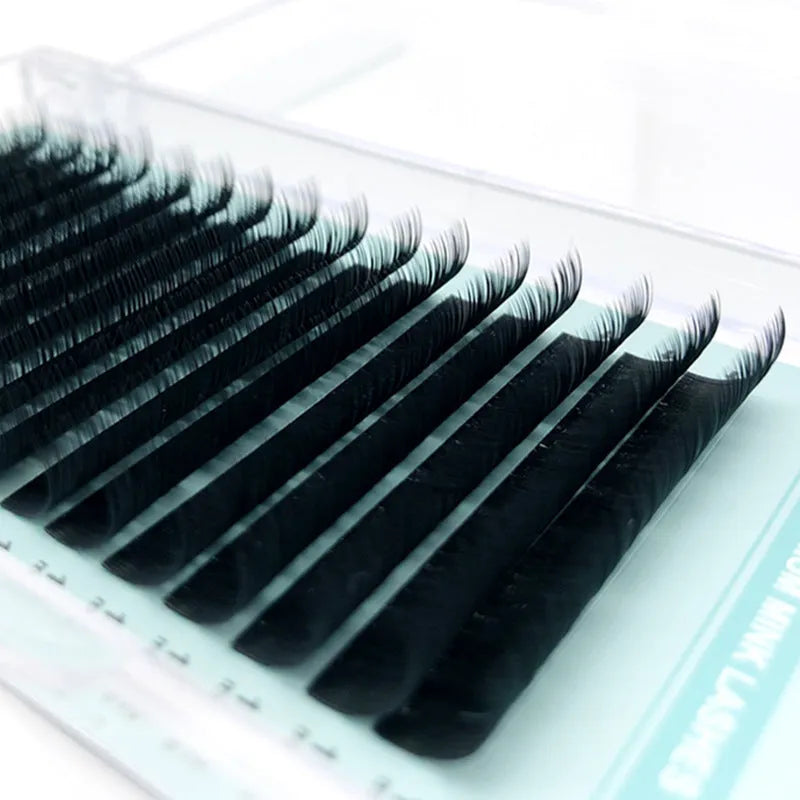 A pair of soft velvet artificial fibre false eyelashes showing options from 7mm to 15mm in length.