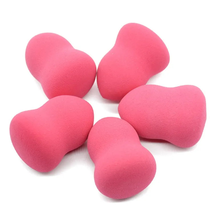 Pink hydrophilic non-latex makeup foundation sponge 4x4x5.6cm on white background