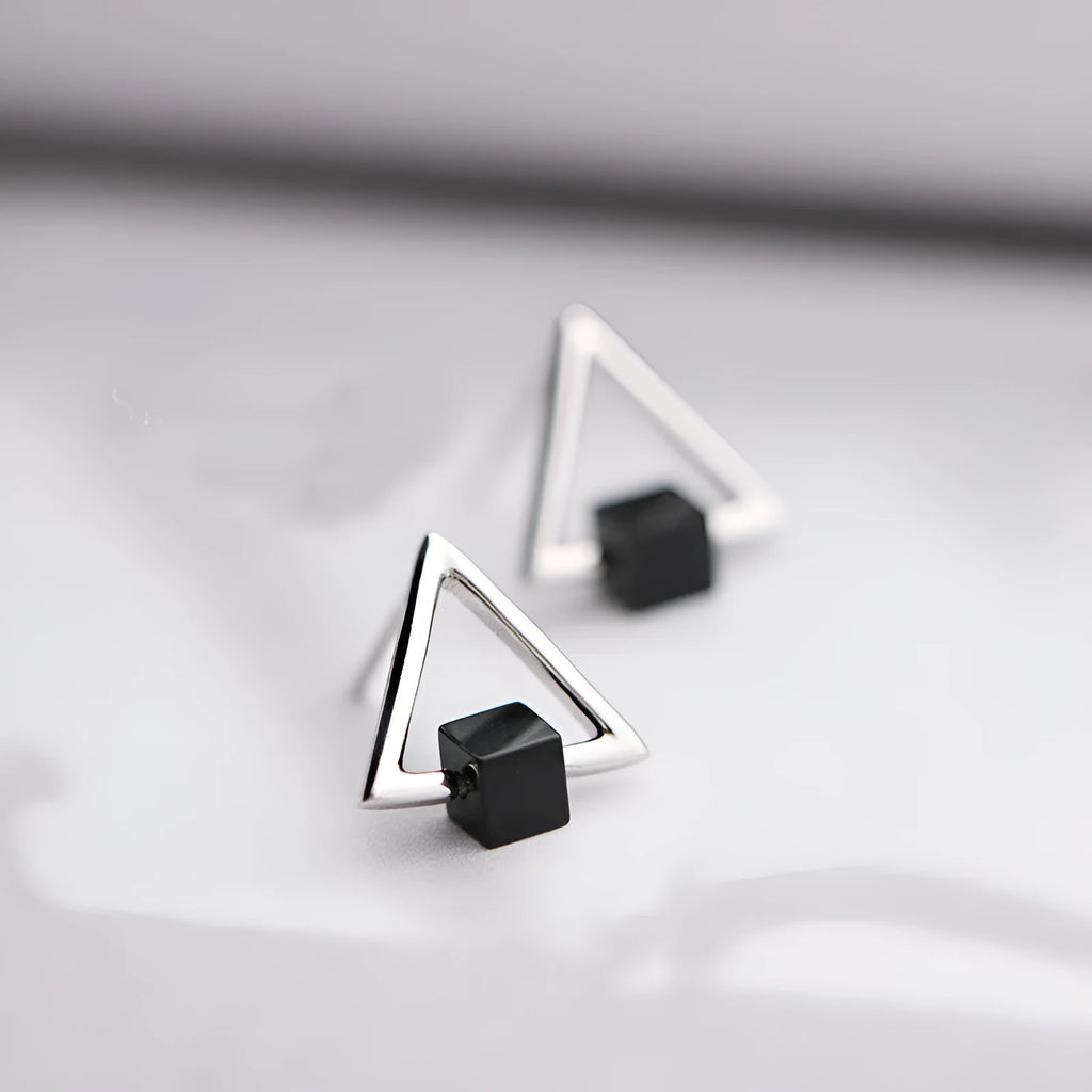 Sterling silver S925 geometric triangle black earrings with gem inlay on neutral background