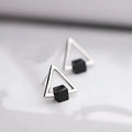 Sterling silver S925 geometric triangle black earrings with gem inlay on neutral background