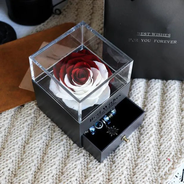 Eternal Flower gift box with preserved roses and carnations inside, measuring 8.5 cm square by 10.5 cm high