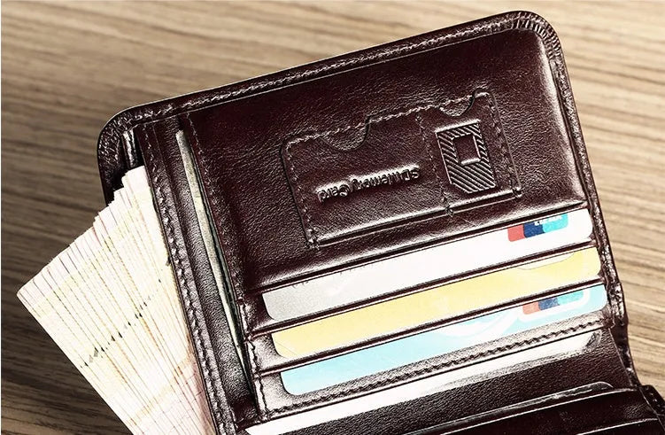 Men's black leather wallet open to show internal card slots, coin pocket, photo holder, and document section.