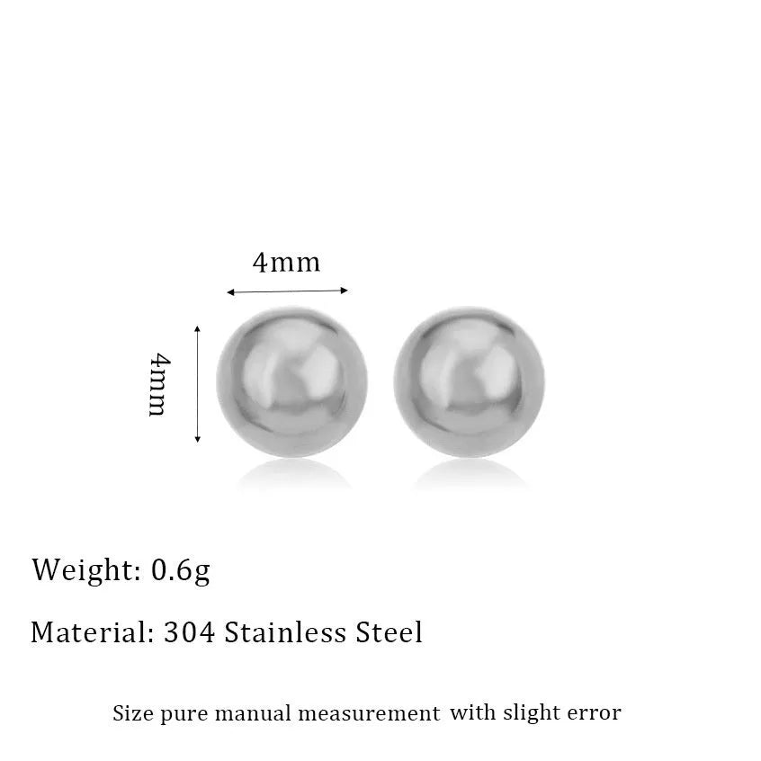 Stainless steel ball stud earrings in gold and silver finishes on a grey background.