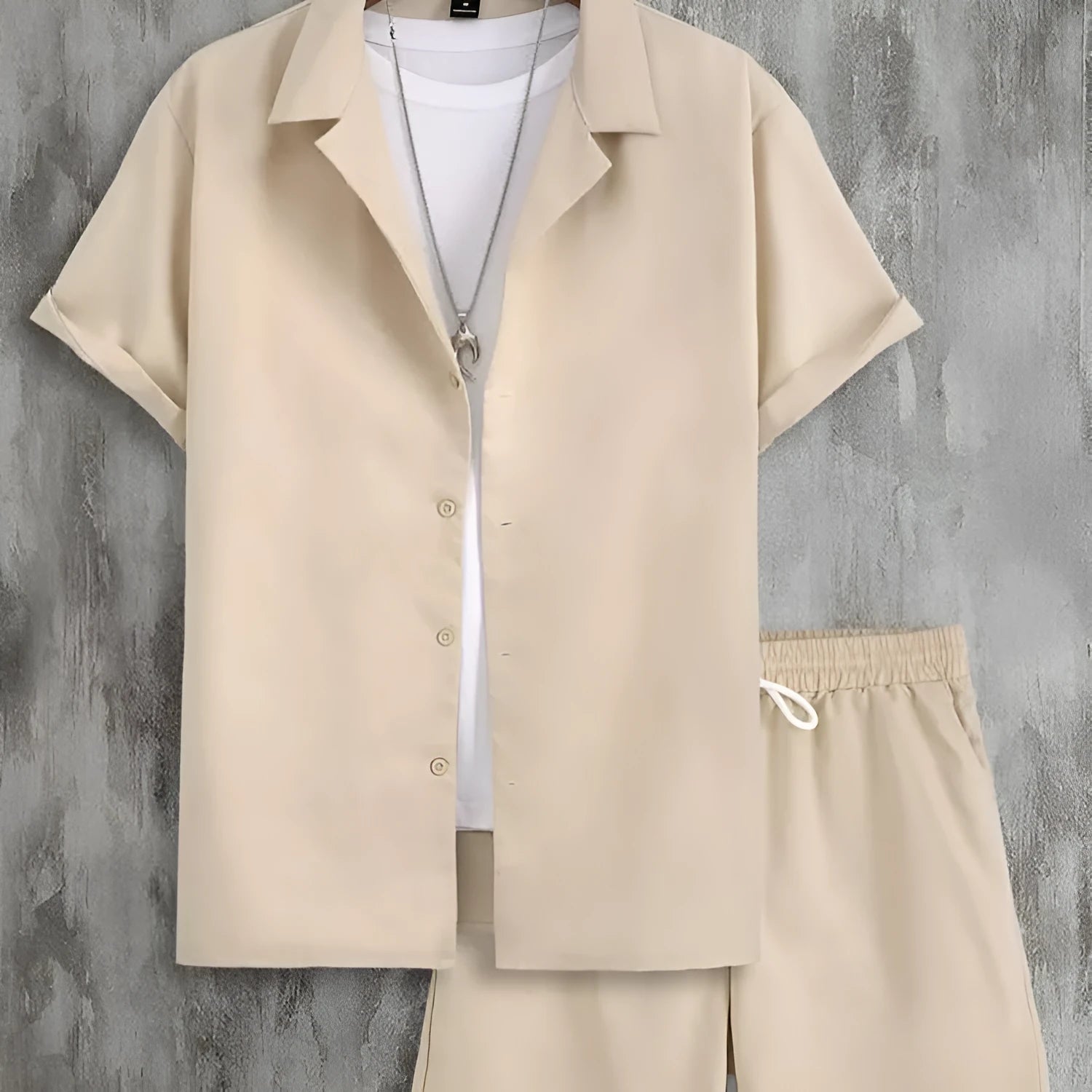Men's white short sleeve Cuban collar sport shirt and matching shorts laid flat.