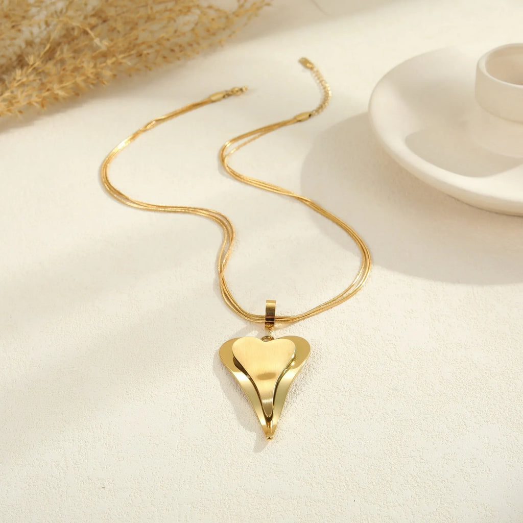 Stainless steel geometric necklace with double heart snake bones pendant in gold or steel colour options