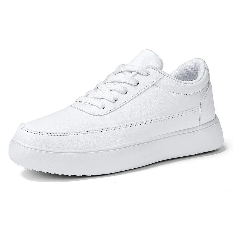Women's white leather casual flat lace-up shoes on a neutral background.