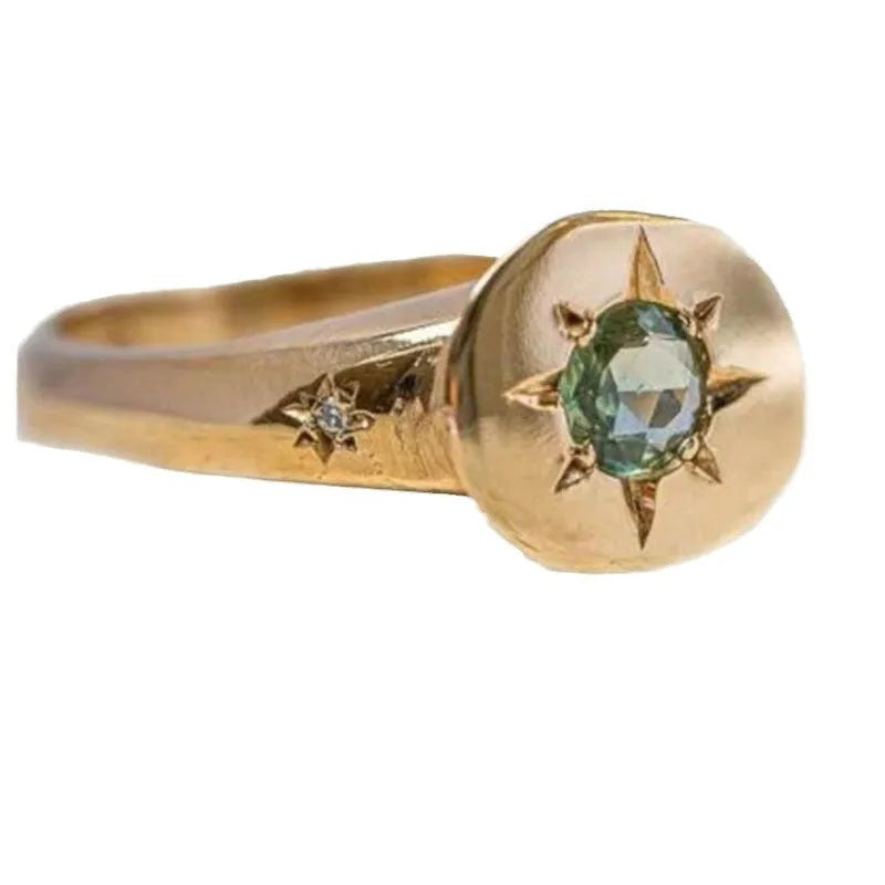 Golden oval ring with star asterism design and adjustable opening mechanism