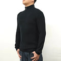 Man wearing a gray half-turtleneck zip sweater in British style for casual leisure wear.