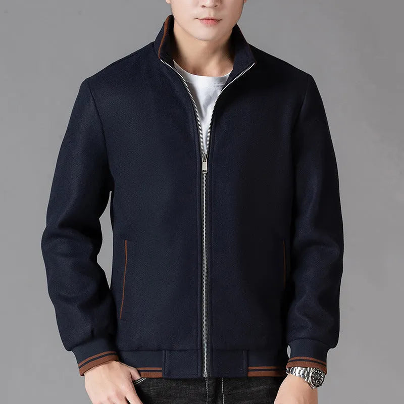 Men's grey polyester fleece jacket with long sleeves and a stick pocket, shown on a hanger.