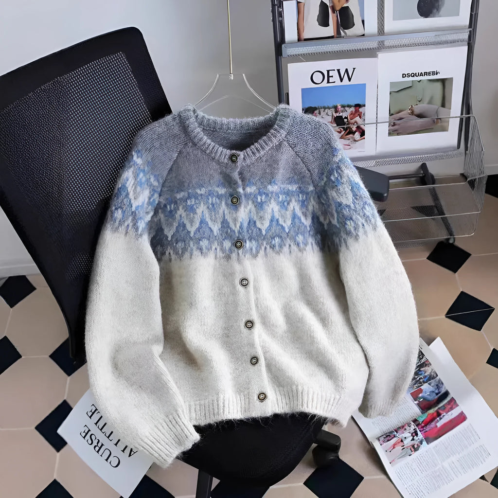 Women's thick jacquard knit sweater coat in a loose fit, shown in milky white colour with long sleeves.