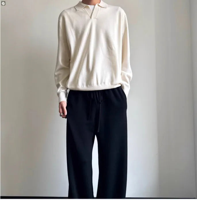 Man's pure wool polo sweater with a lapel collar in a loose fit, shown in navy blue.