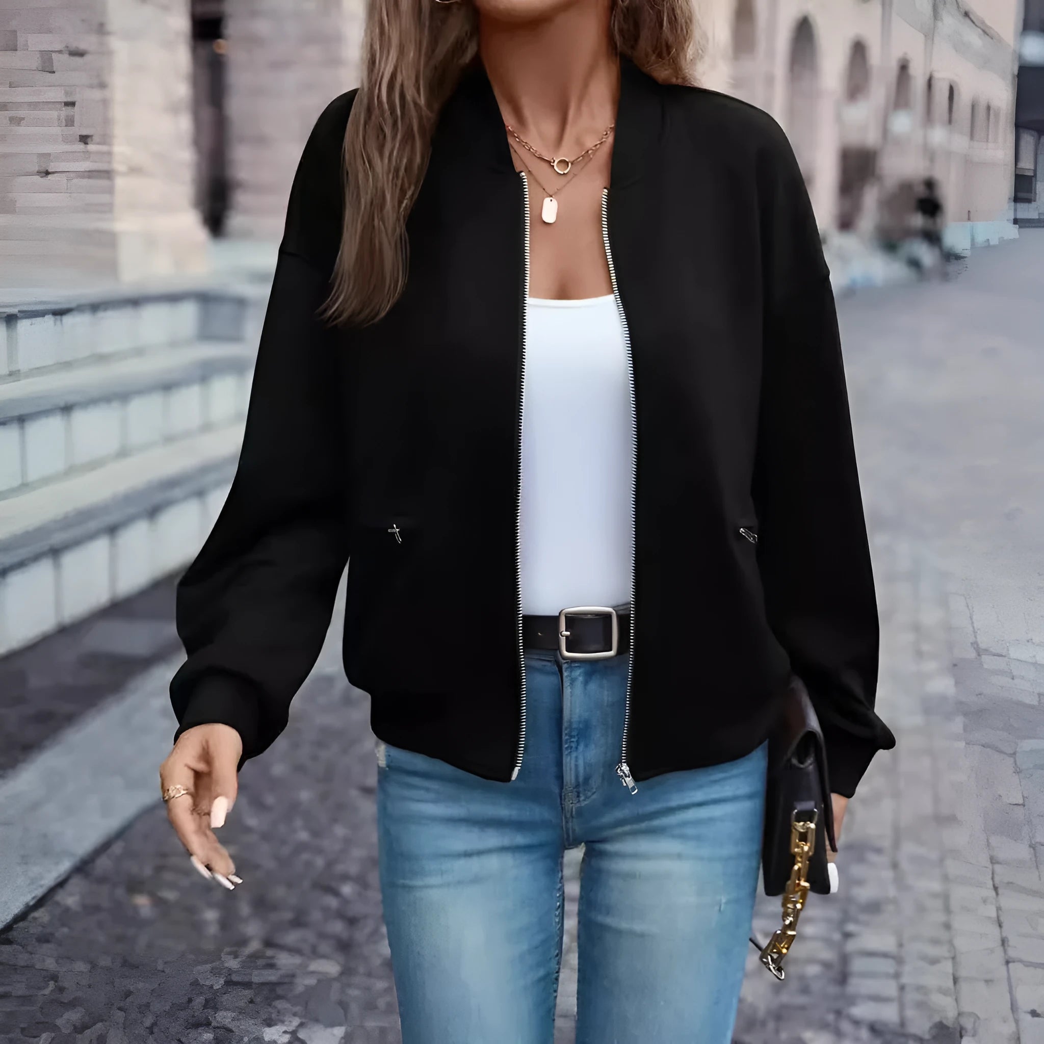 Women's black polyester zip jacket with long sleeves and faux pocket detailing